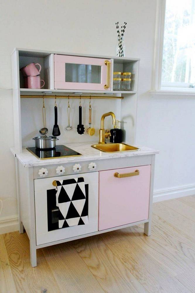 30-pretend-kitchens-we-kind-of-wish-were-real-kid-kitchens-white-kid-kitchen-with-pink-door-578850d281c866970ee812c3-w1000_h1000